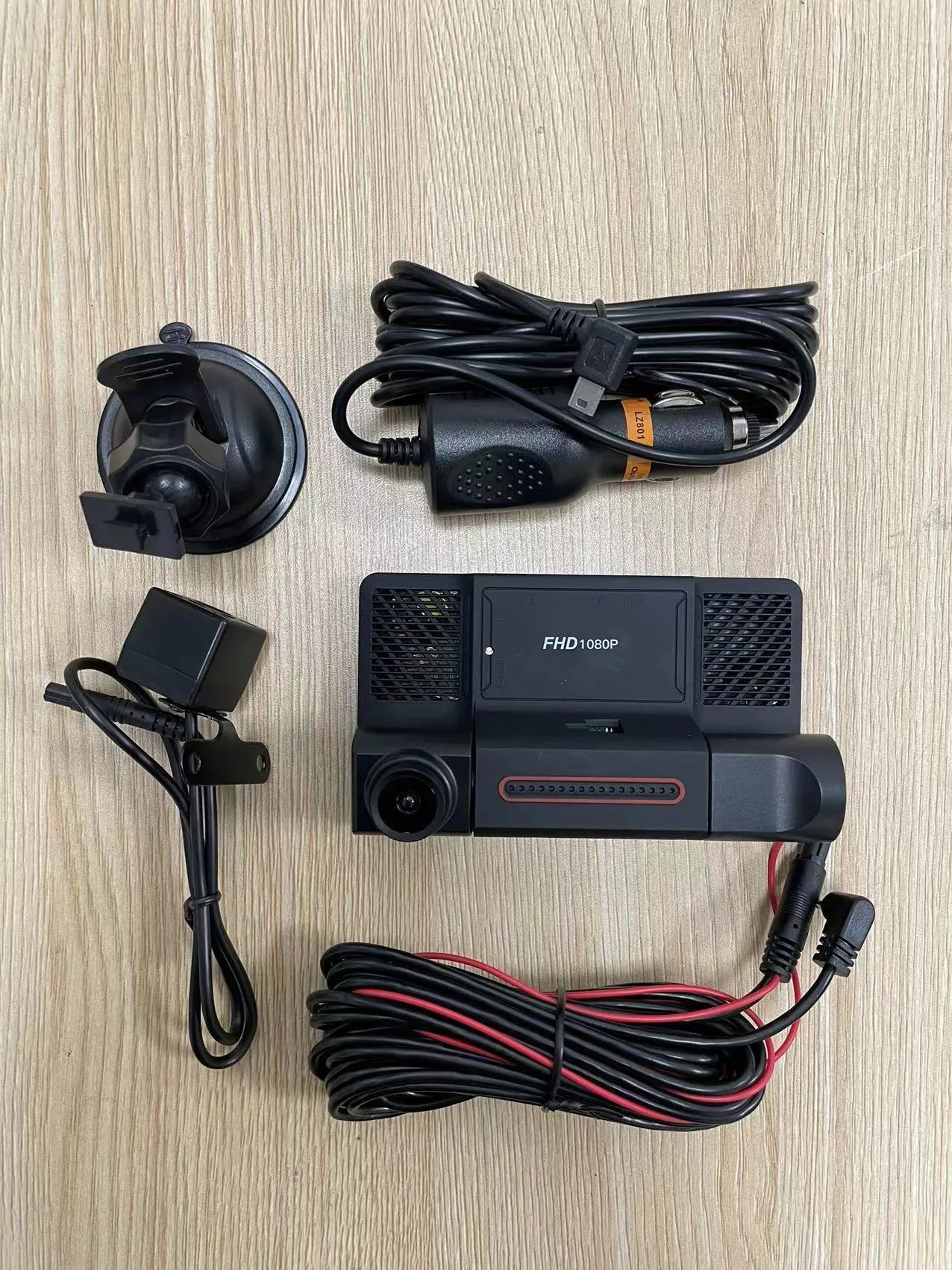 Black three lens dashboard camera with 4 inch touch screen for front and rear vehicle recording