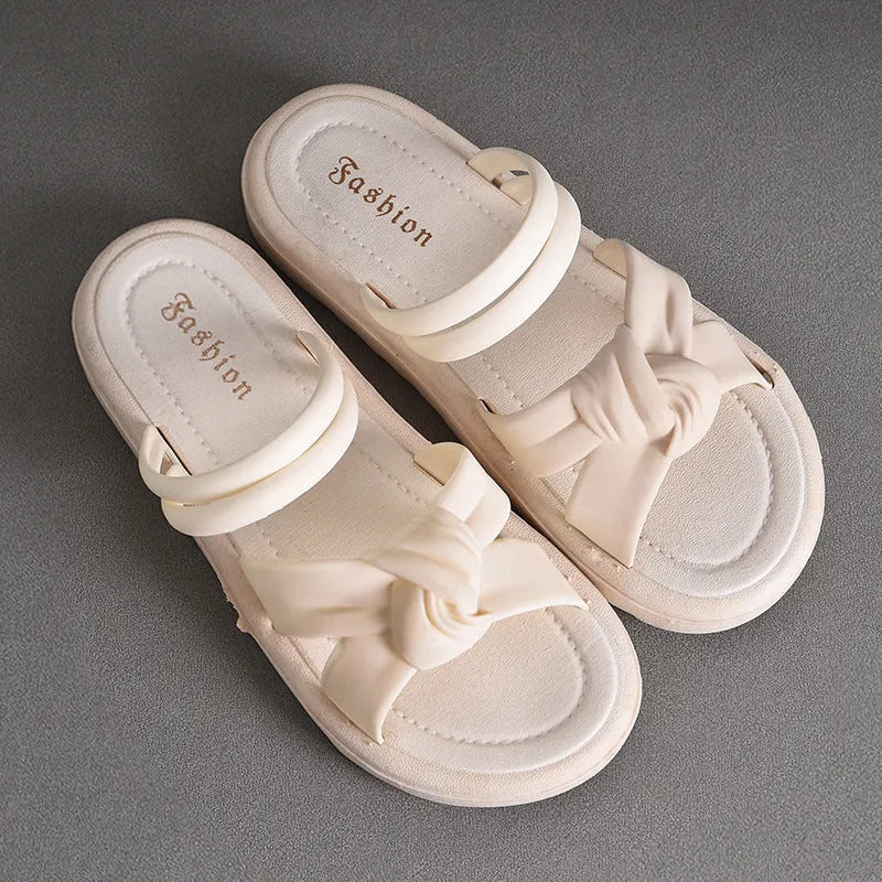 Women's black and white soft back outdoor sandals with flower detail and PVC sole