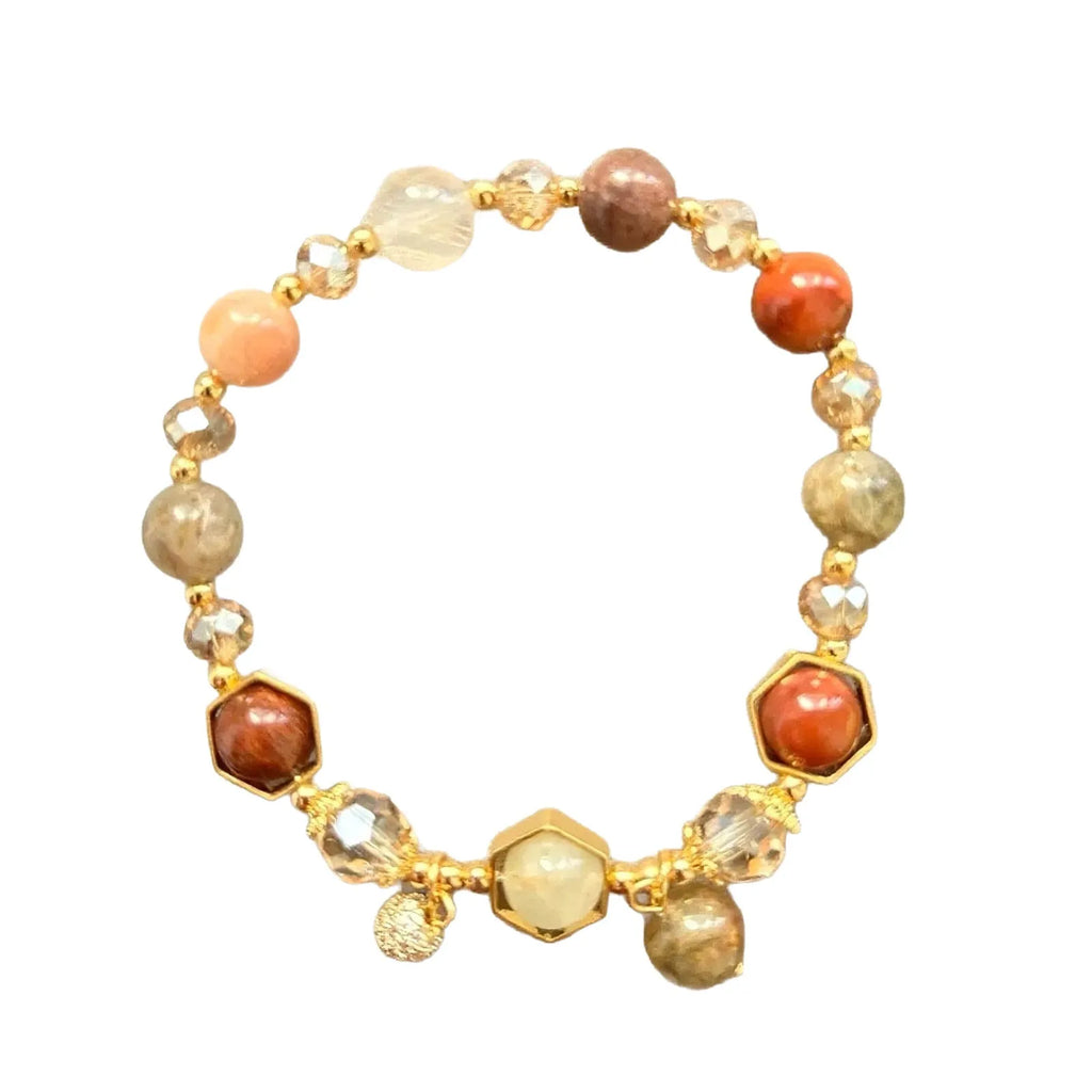 Gold citrine crystal bracelet with Fu character, safety lock, and cloud pattern charms on wrist
