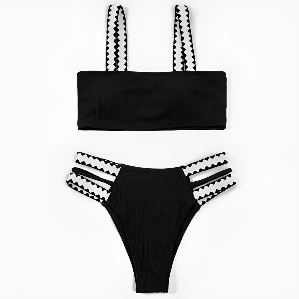 Black women's hollowed-out split swimsuit bikini on a neutral background