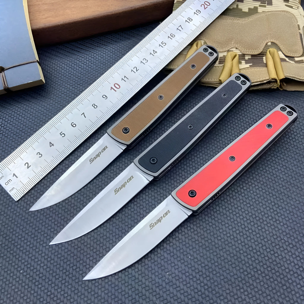 CRKT 7190 folding fruit knife with stainless steel blade in black, red, or coffee colour, showing closed and open positions
