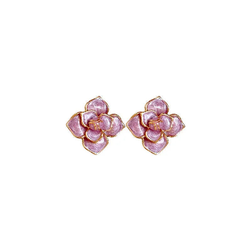 Gold plated purple oil-spot glaze 3D flower stud earrings with surgical steel posts on a white background.