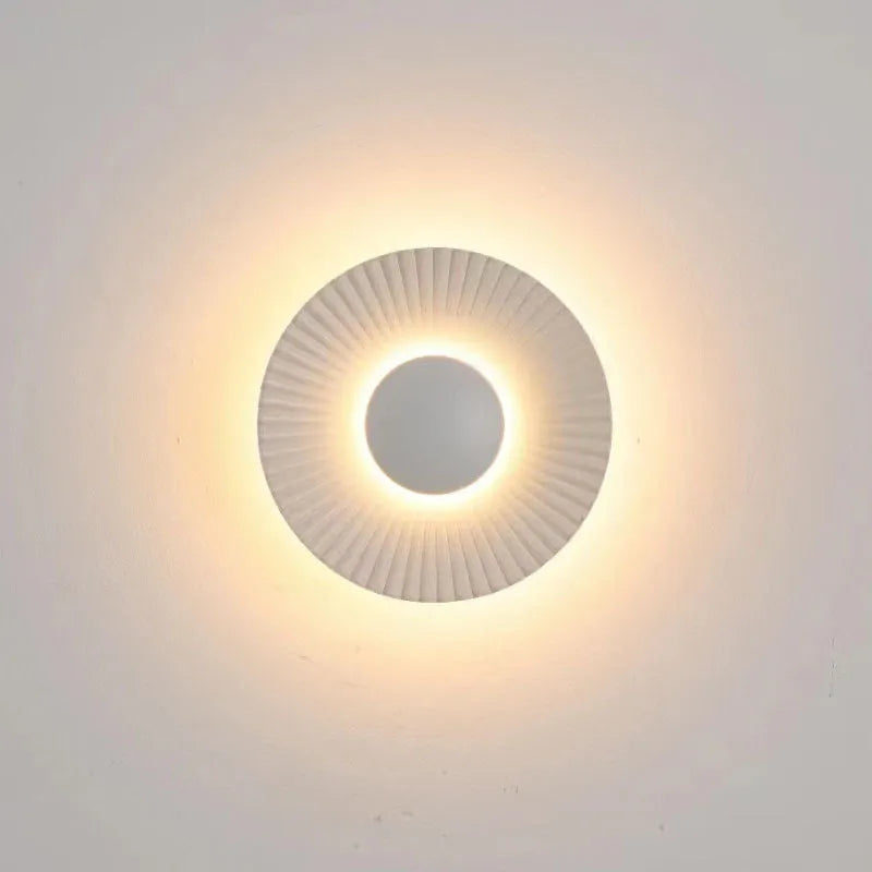 Round wall-mounted LED light with aluminium shade in a gold and white two-tone colour option.
