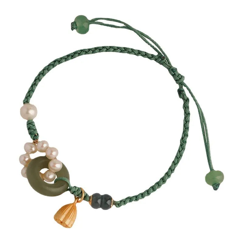 Hand-woven flexible wire watch bracelet with pearl peace buckle closure on wrist