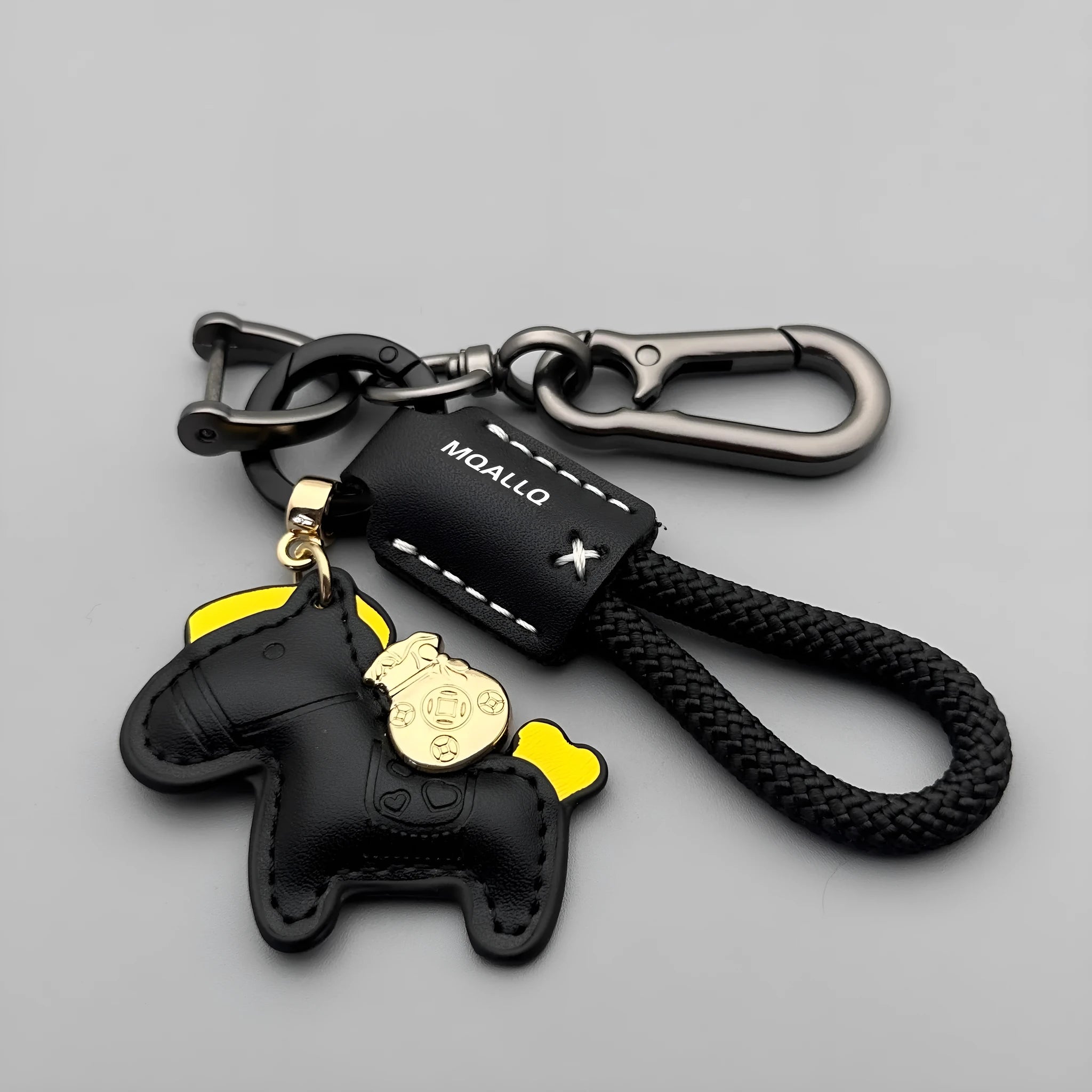 Handmade brown cowhide key ring pendant with a zinc alloy pony belt buckle and green flanelle rope.