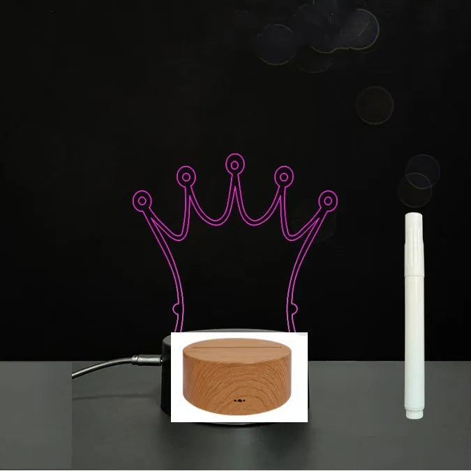 3D acrylic LED message board with touch control, black ABS base, USB cable, and stylus pen on desk