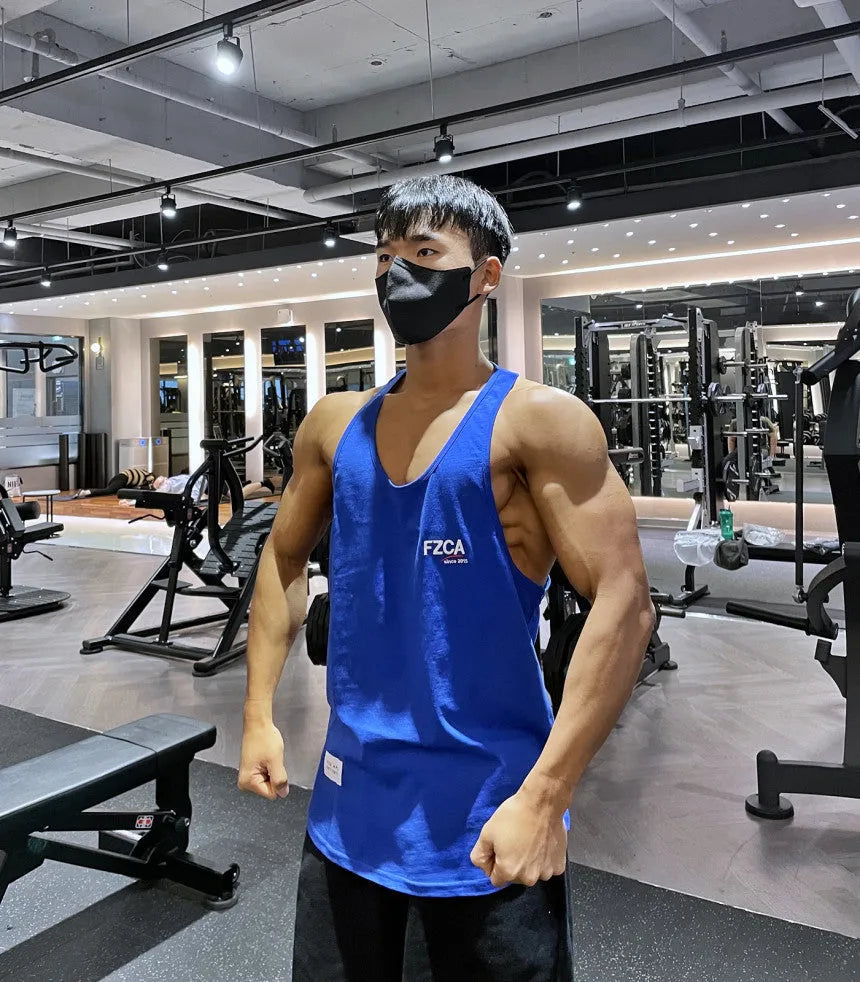 Men's cotton fitness vest in multiple colours for summer running and gym training.