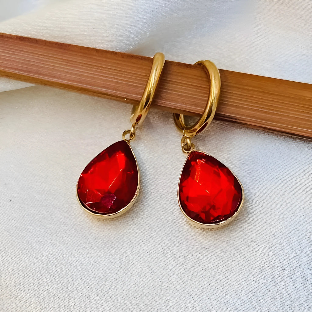 Geometric water drop earrings with Saturn design elements in colourful rare earth glass and copper