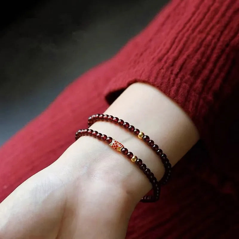 Wine red glass bead garnet bracelet with new Chinese style design showing single circle configuration