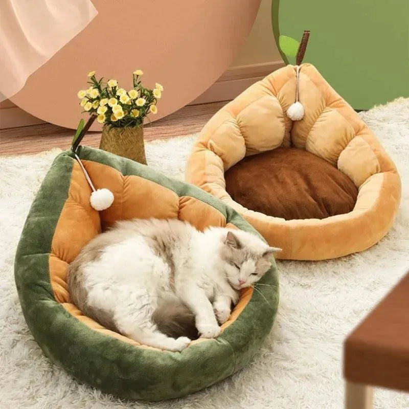Green cotton pet bed with a plush raised rim for a cat or small dog.