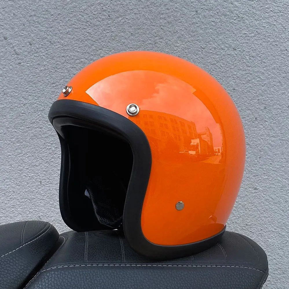 Retro-style open-face motorcycle helmet in cement grey with a textured finish and quick-release chin strap.