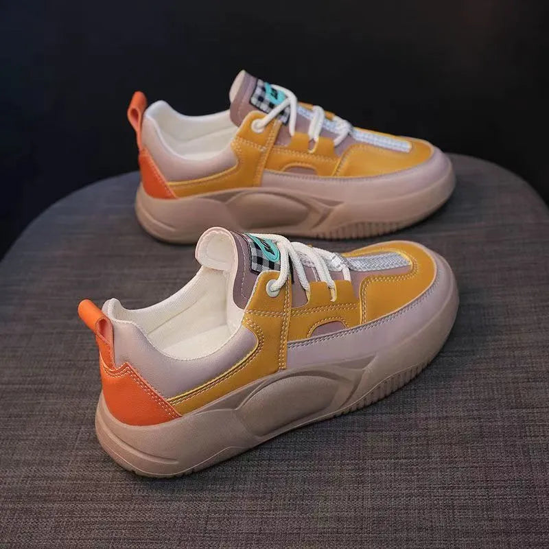 Women's beige thick-sole stitching sneakers with round toe and front lacing on a white background