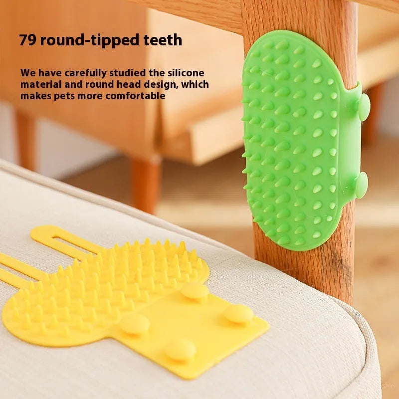 Silicone cat grooming comb with rounded teeth and adjustable strap mounted on a table leg.
