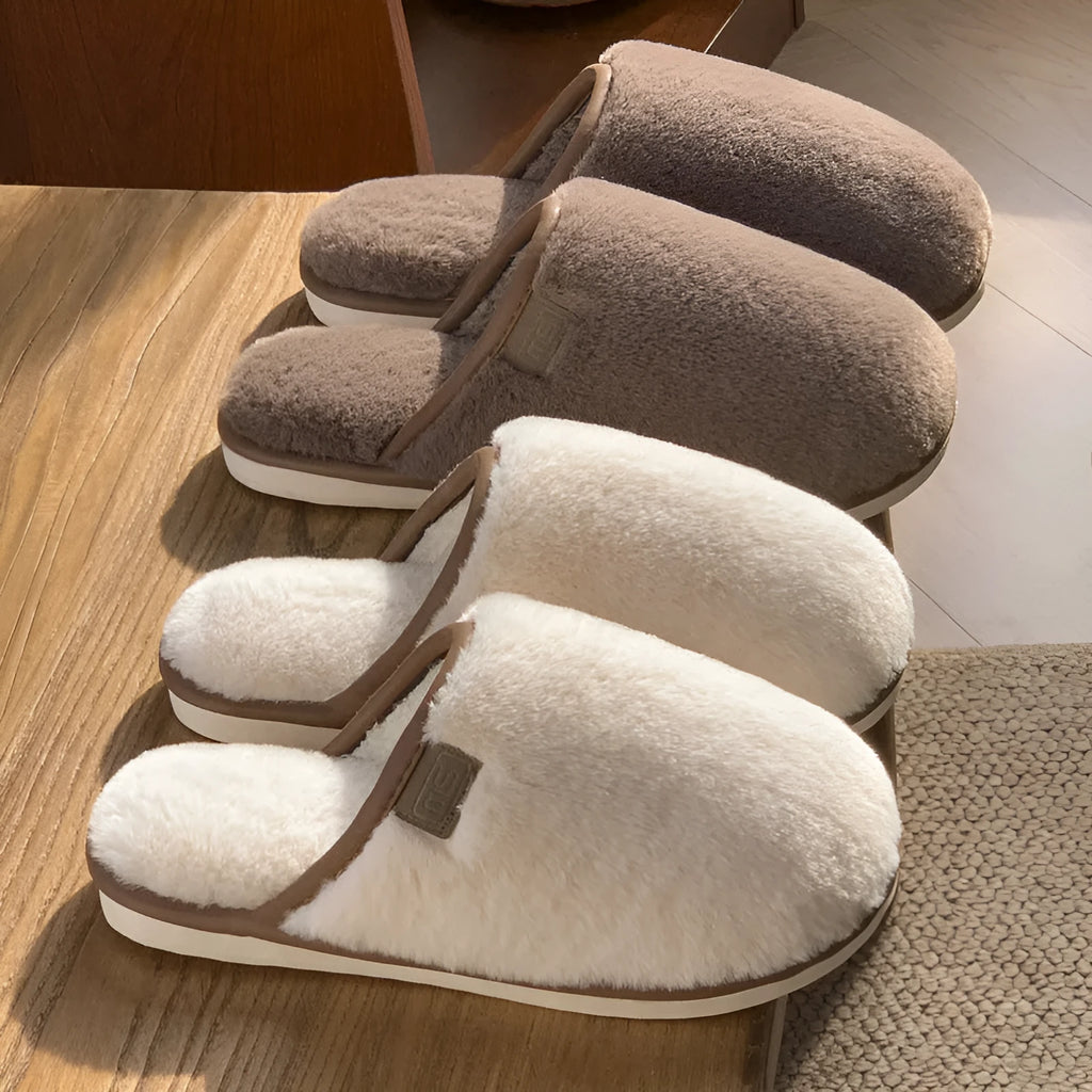 Solid colour plush slippers with PVC non-slip sole and car stitching detail on the upper.