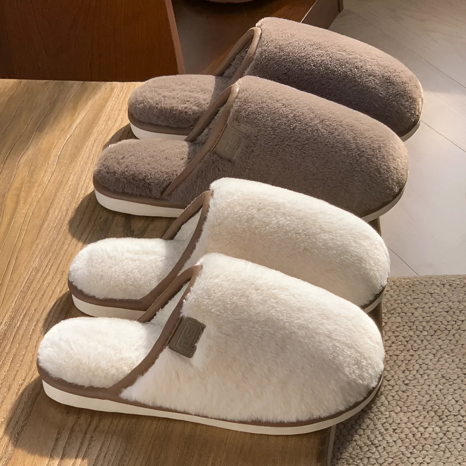 Solid colour plush slippers with PVC non-slip sole and car stitching detail on the upper.
