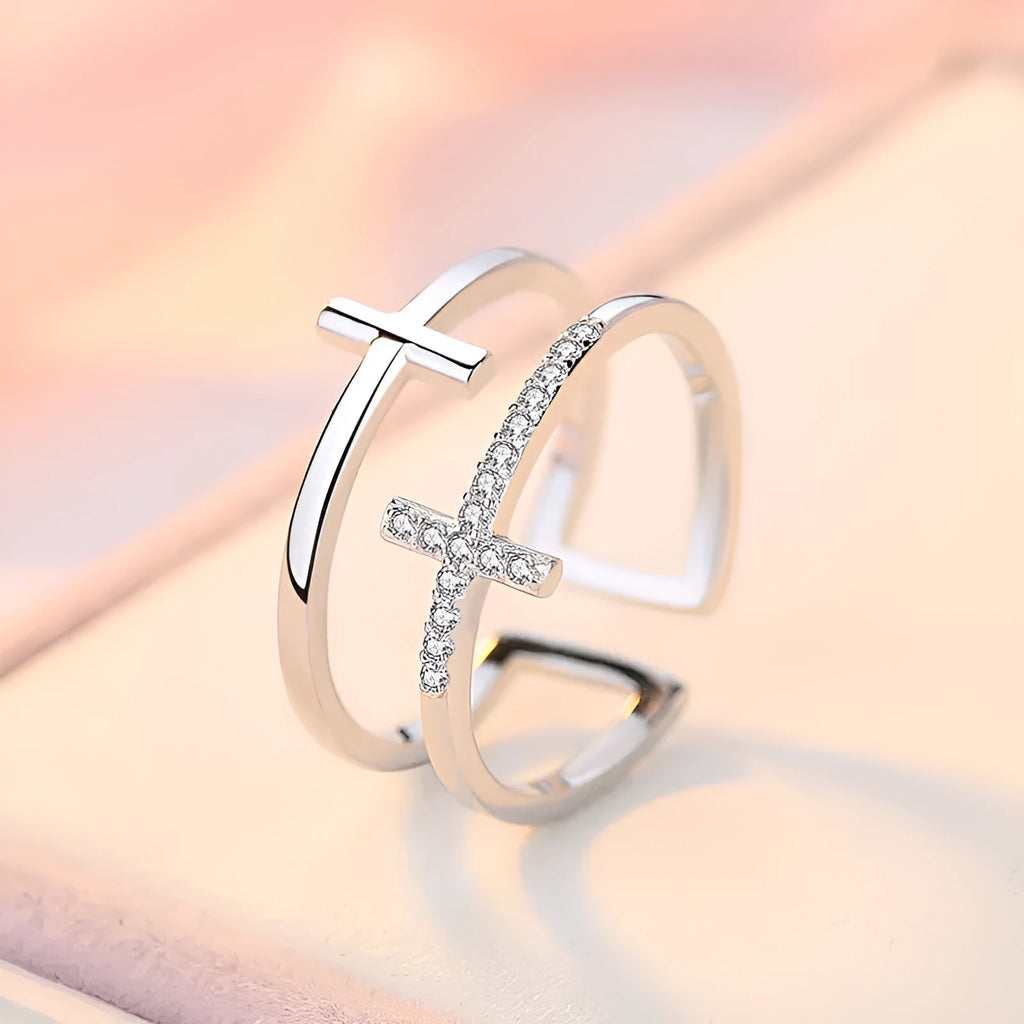 Double cross geometric women's ring with zircon stones on an adjustable copper band.