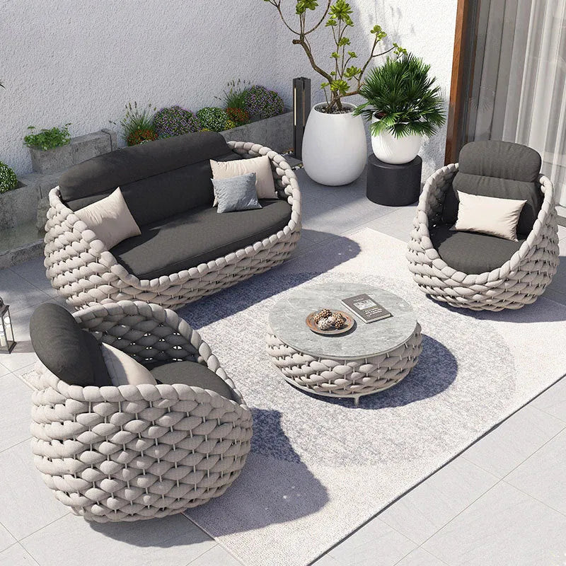 Outdoor patio lounge sofa coffee table set with PE rattan finish, alloy frame, and high-density sponge cushions