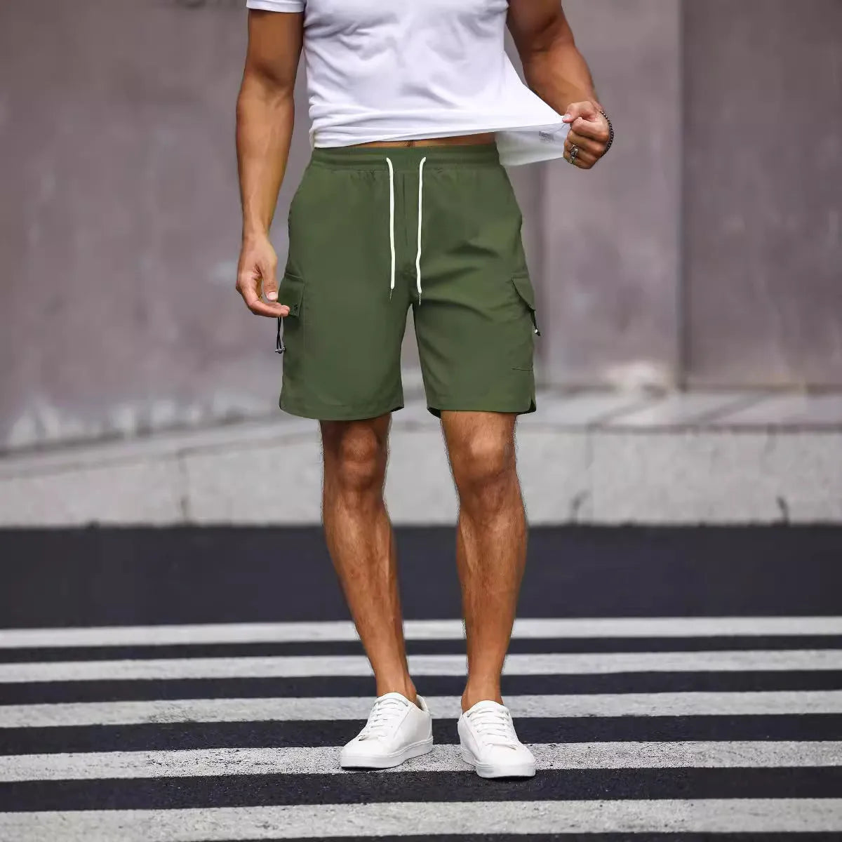 Men's loose fit workwear shorts in fluorescent green and army green colours with straight cut and fifth pants length