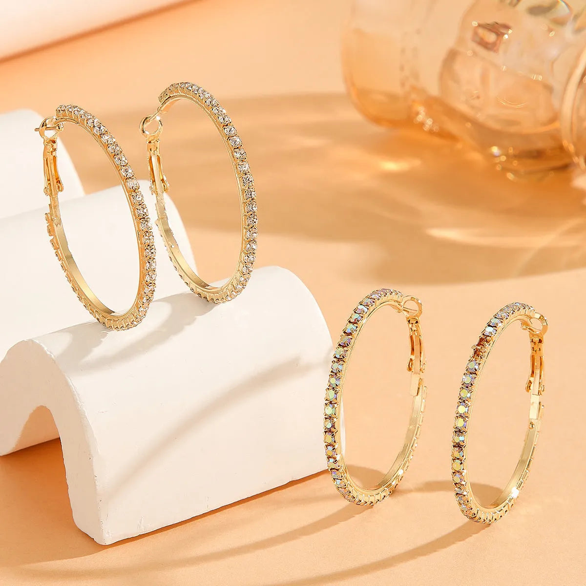 Large gold plated copper zircon hoop earrings for women, princess style, gold colour, on white background