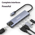 Aluminium Steam Deck docking station with six ports including HDMI, Ethernet, and USB, showing a 15cm cable.