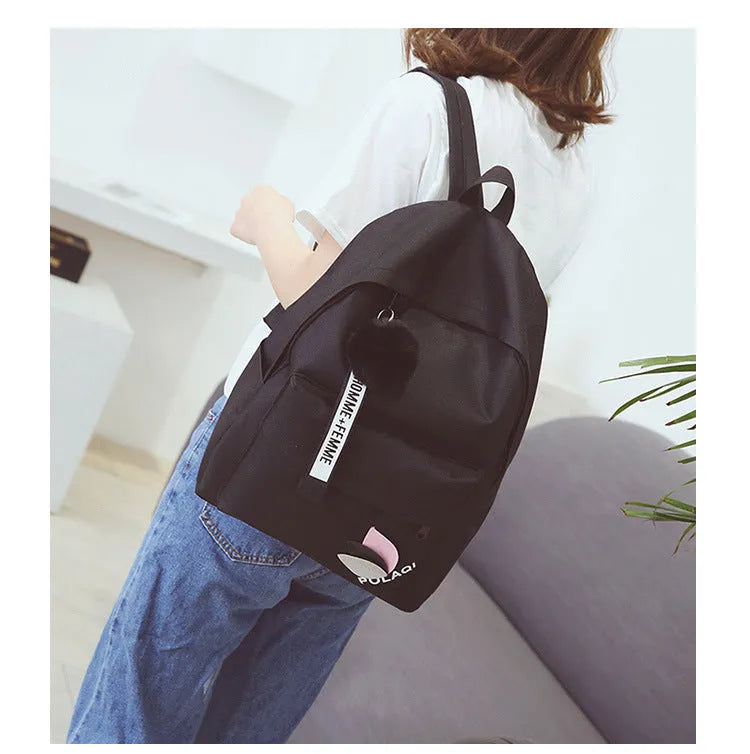 Green canvas college style schoolbag with leaves pattern and anti-theft features