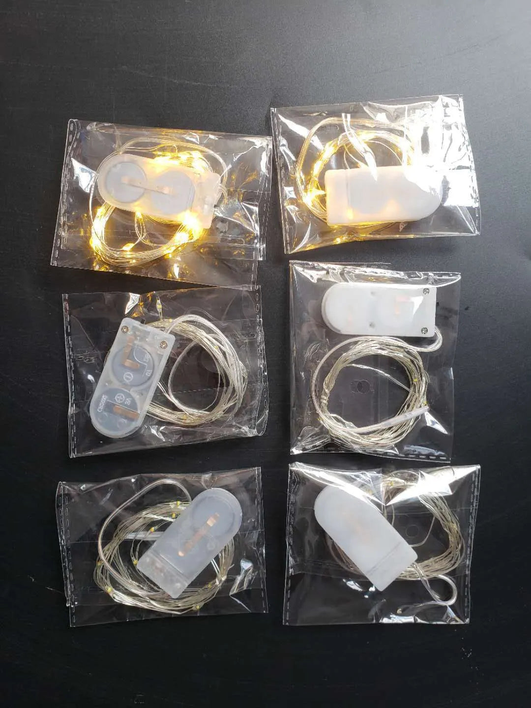 2 metre LED copper wire light string with battery box showing warm white and white light options