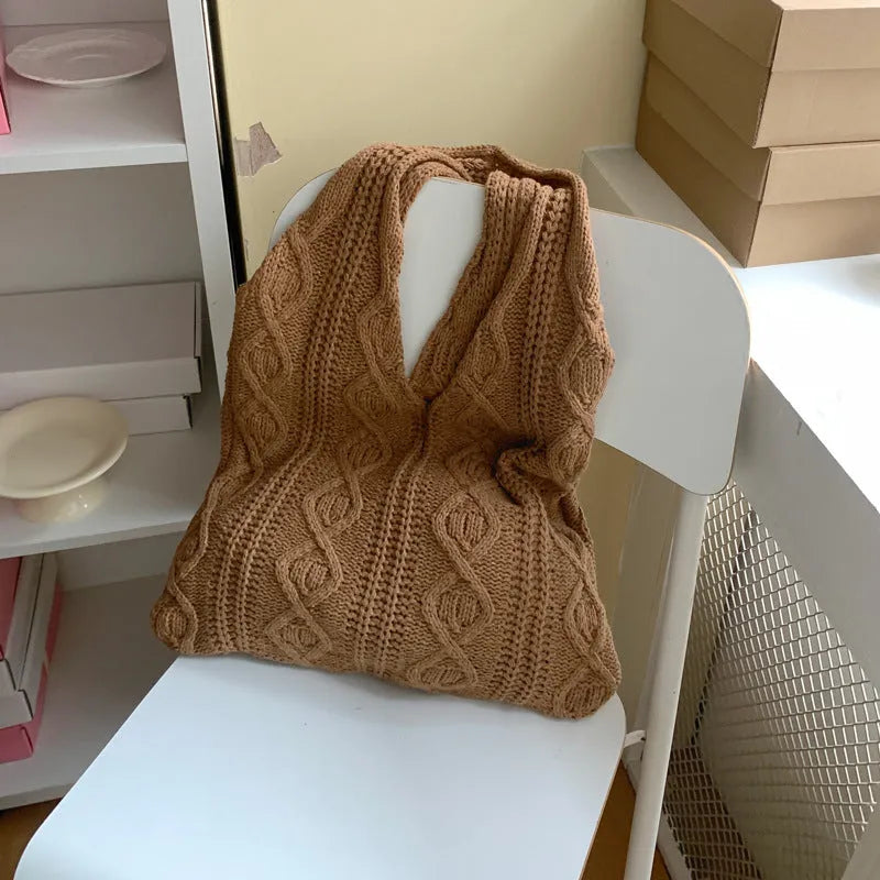 Retro crochet women's tote bag with double shoulder straps in a grass green colour, showing textured knit detail.