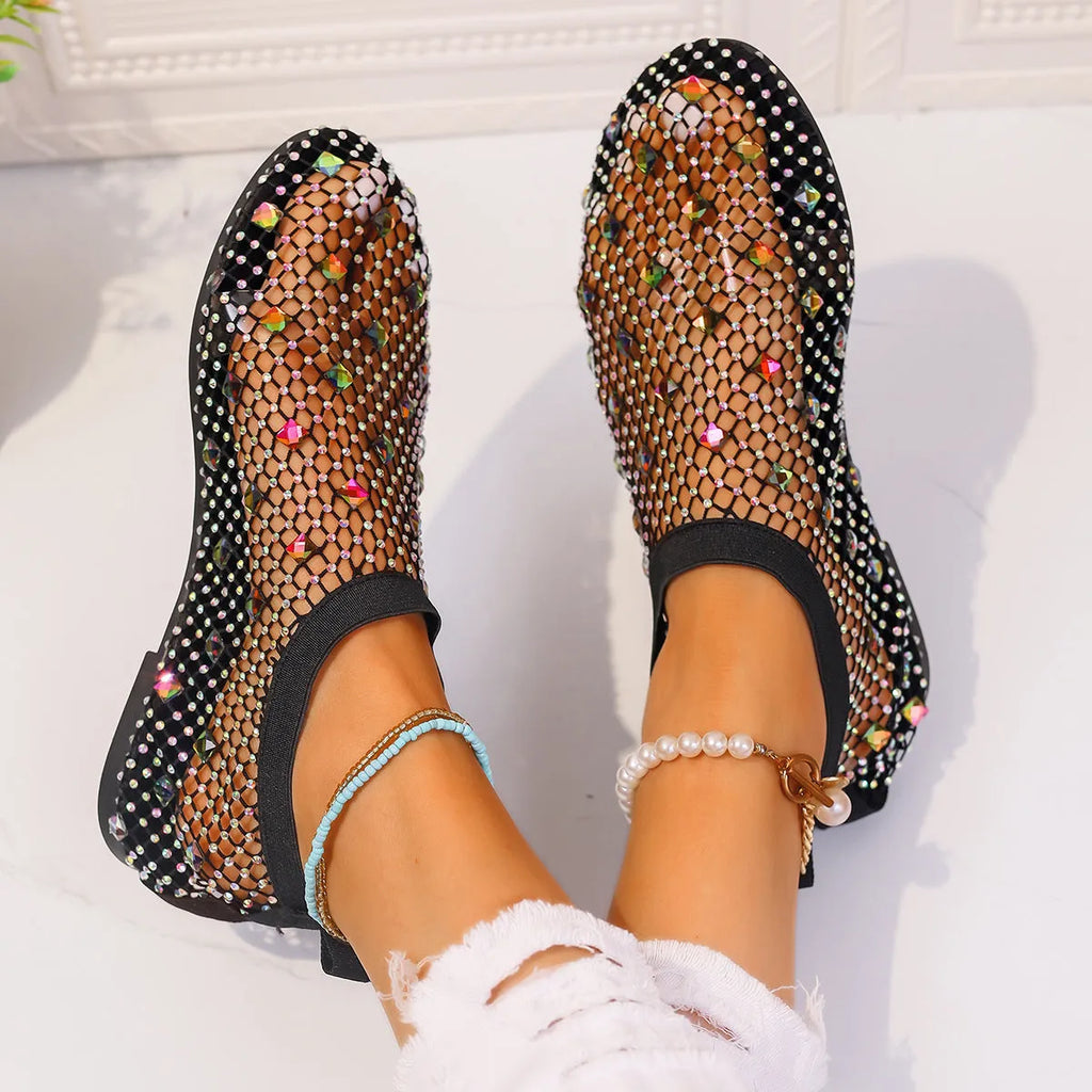 Women's flat sandals with a colourful rhinestone design on a breathable mesh upper and a rubber sole.