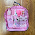 Roadfisher Newborn Baby Care Kit in pink or blue, showing safety scissors, brush, comb, thermometer, and syringe.