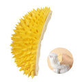 Yellow durian-shaped cat corner scratcher and self-groomer mounted on a wall