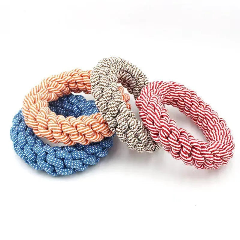 Natural cotton braided ring dog chew toy showing woven knot texture
