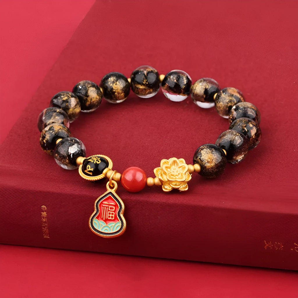 Lotus Blessing Card bracelet with 8mm glass beads, fragrant grey glaze, and gold foil electroplated accents