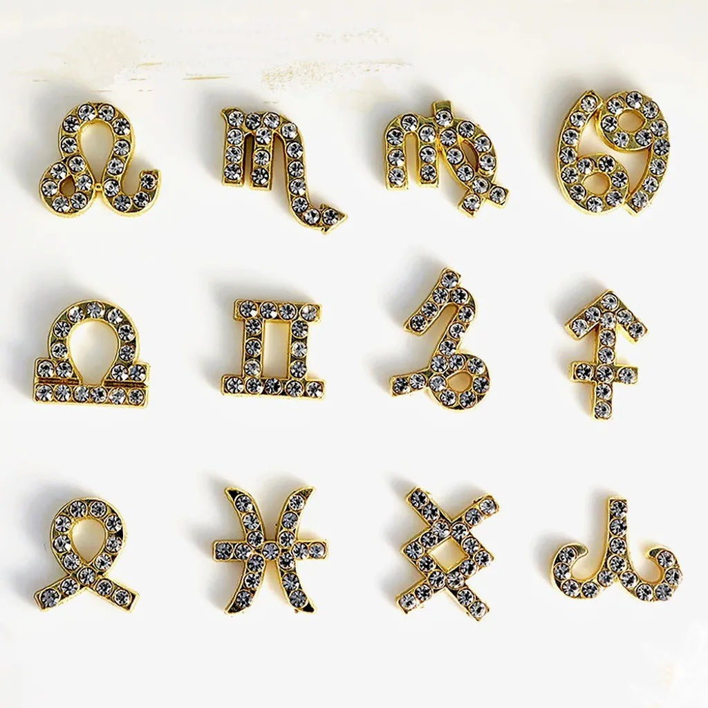 Twelve zodiac nail art accessories in alloy with diamond inlays, silver and gold finish, starry sky pattern.