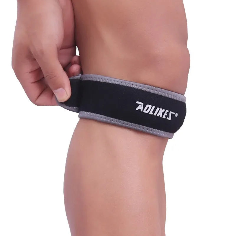 Black and grey adult patella retinaculum knee support strap for sports
