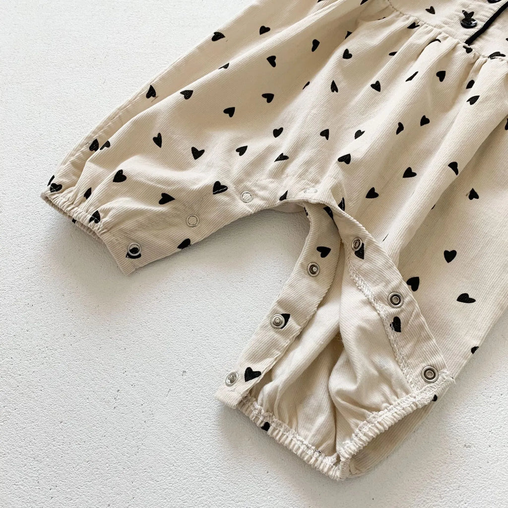 Baby onesie autumn corduroy long sleeve neutral gender beige infant bodysuit on white background