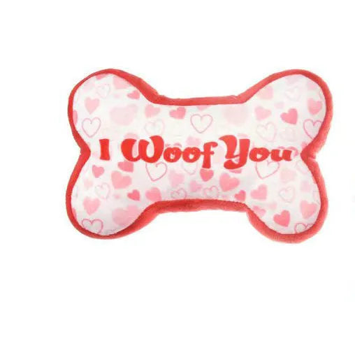 Vocalising plush dog chew toy in peach heart pink colour for dental play and bite resistance.