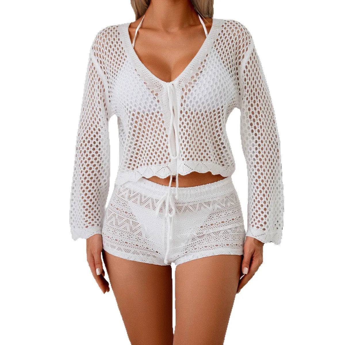 Short apricot coloured women's cardigan blouse with flared bell sleeves, laid flat.