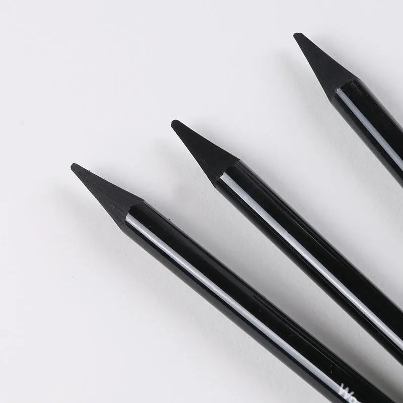 Set of nine wooden drawing pencils, six graphite and three carbonized, on a suction card.