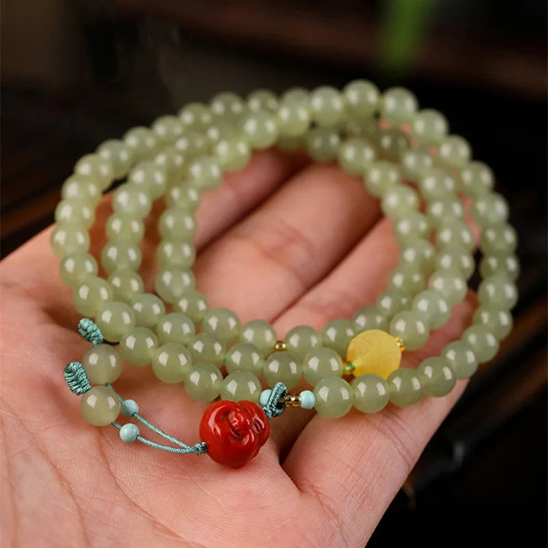 Pale blue Hetian jade bracelet with 6mm beads arranged in three-circle pattern