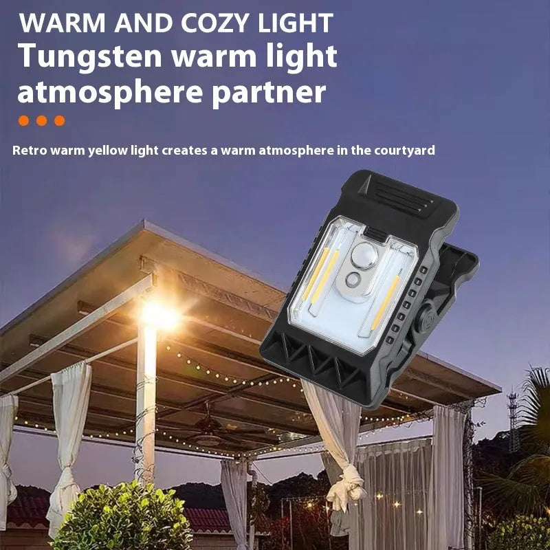 White ABS plastic motion sensor clip lamp with LED light, shown attached to a cupboard door edge.