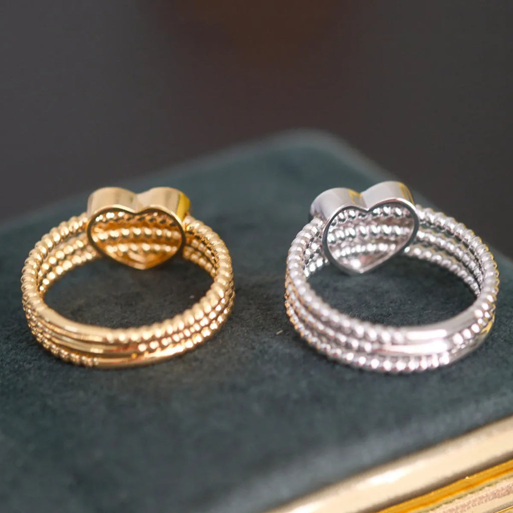 S925 sterling silver twisted heart ring for women, electroplated white gold finish, US size 7.