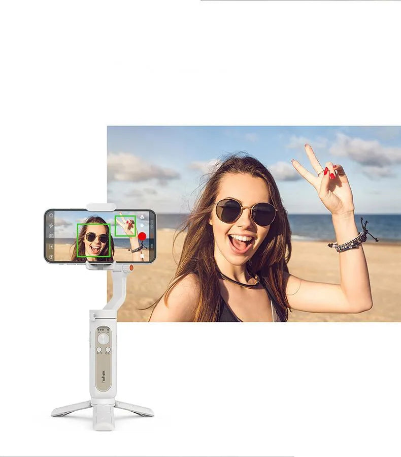 Black 3-axis mobile phone stabilizer gimbal shown in folded position next to a selfie stick.