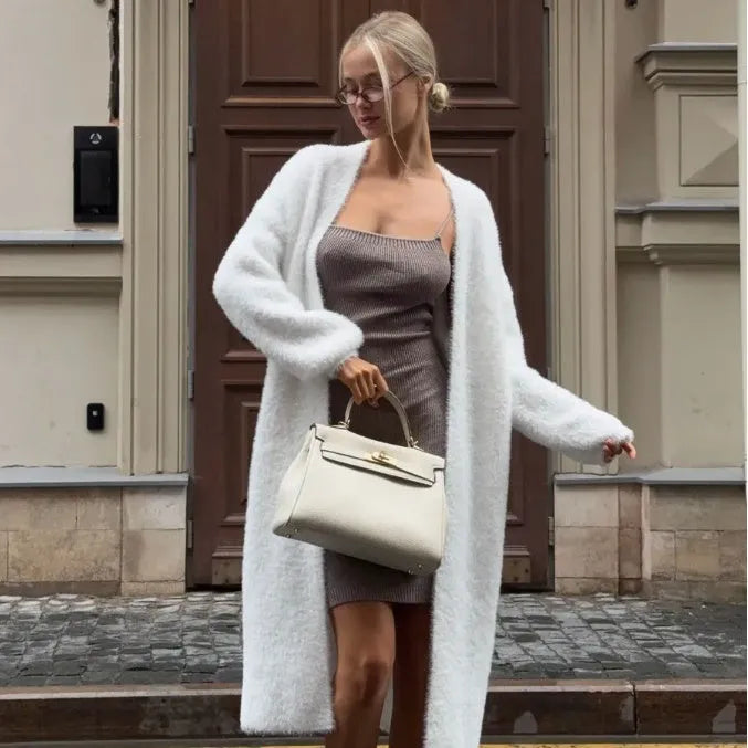 White knitted cardigan jacket for women with long sleeves and a loose fit.