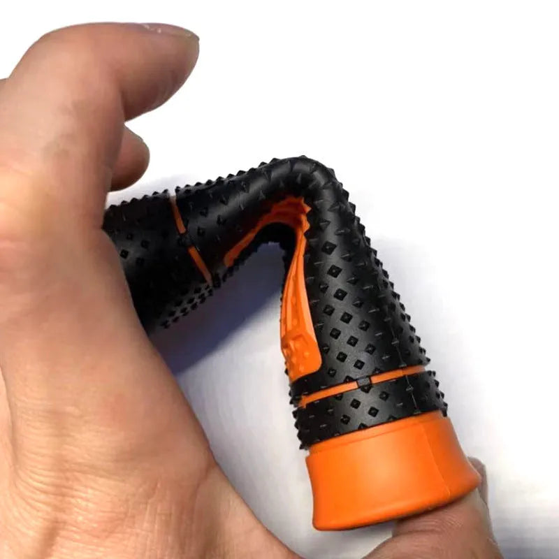 Pair of black and orange rubber motorcycle handle covers for KTM off-road bikes, shown on handlebars