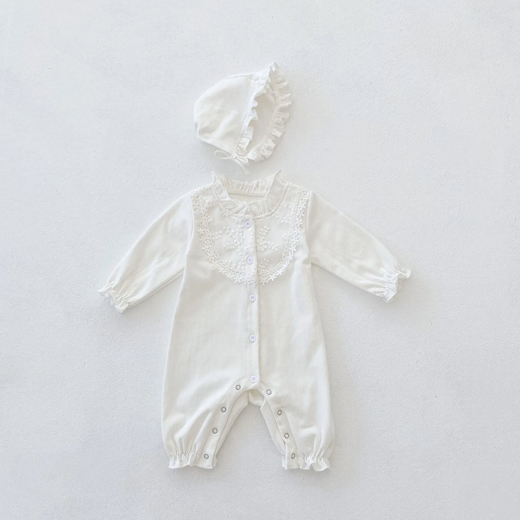 Beige knitted cotton baby jumpsuit with wooden ear collar and lace, long sleeves, hood, on a neutral background