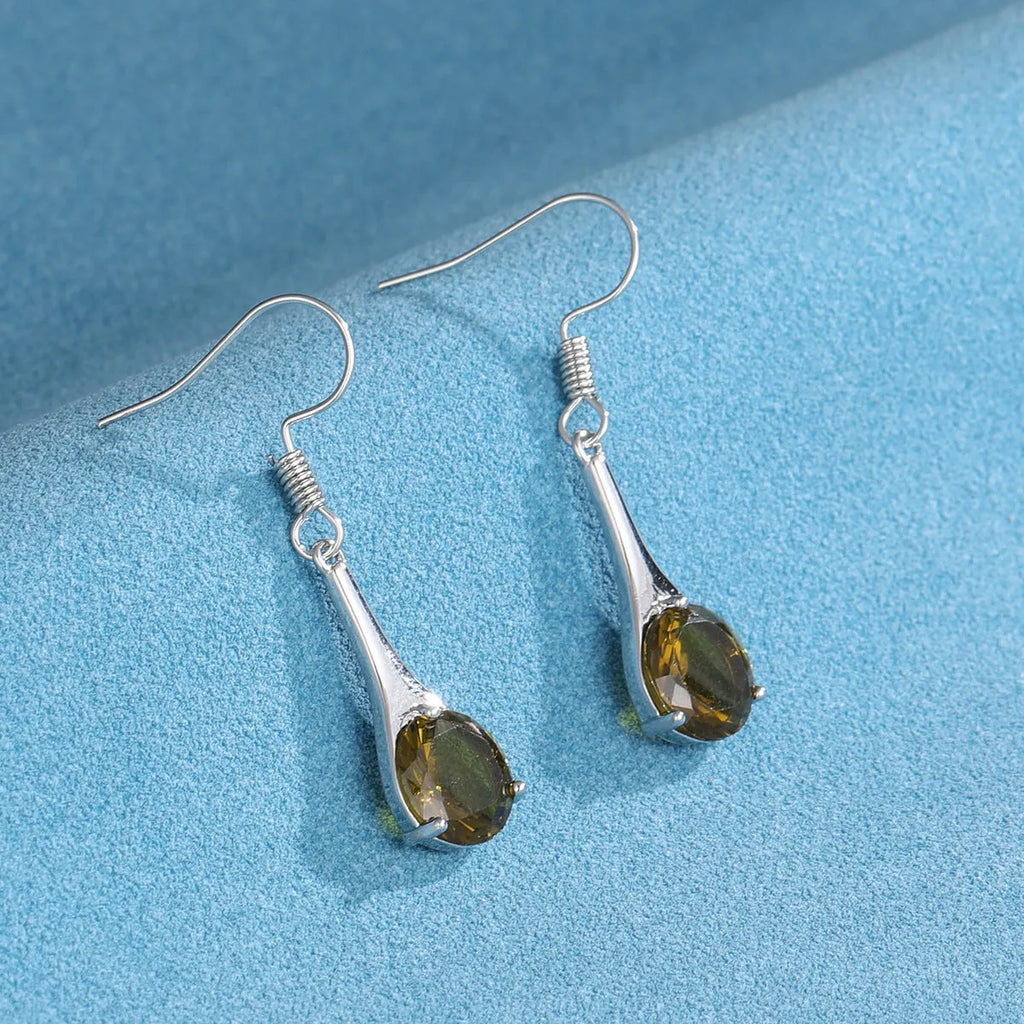 Olive green topaz colour earrings with water drop shape and retro style design