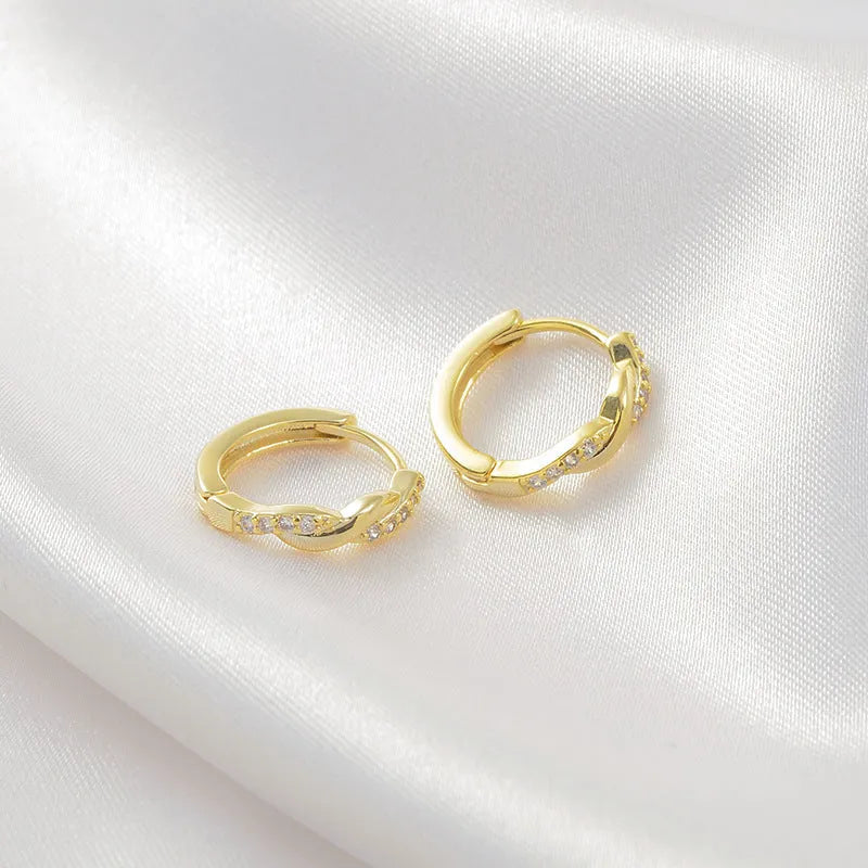 Geometric interwoven hemp rope earclip earrings in a gold or silver copper finish.