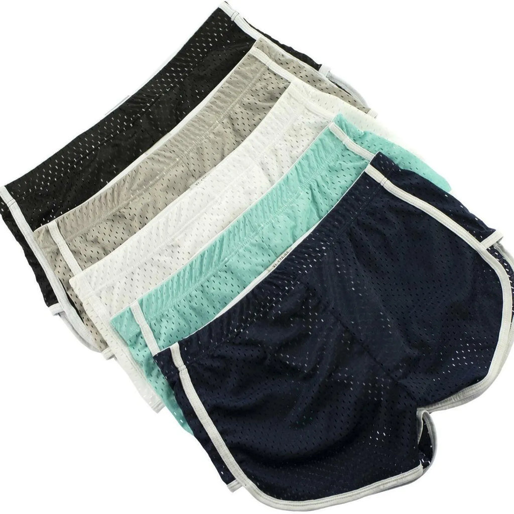 Men's cotton three-point boxer shorts in light blue, laid flat to show mid-waist design and trunk style.