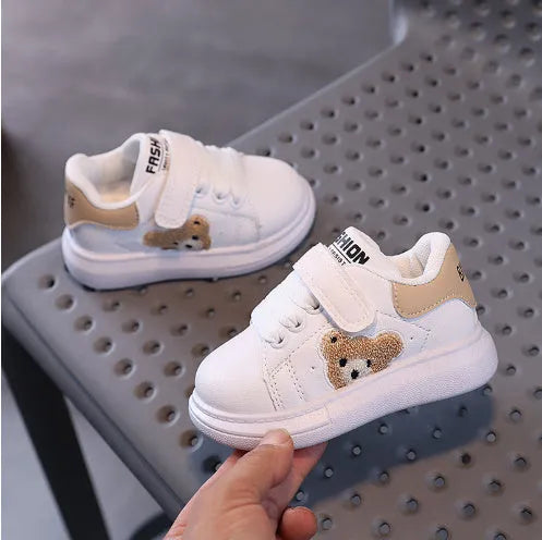 Baby Bear cartoon pattern kids sports sneakers in black, green, and khaki on a white background.
