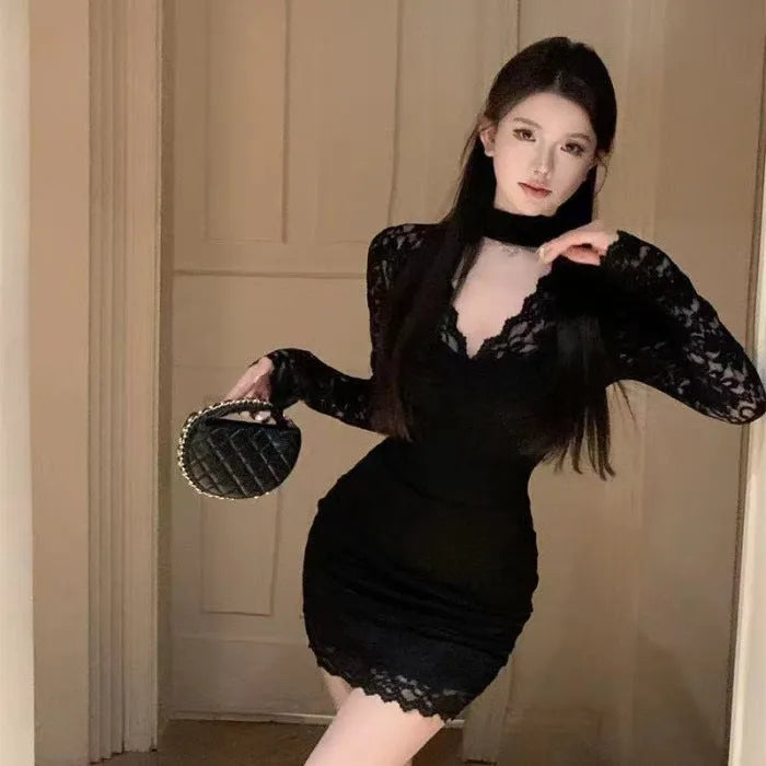 Black floral lace halter dress with inner skirt and high-waisted A-line silhouette.